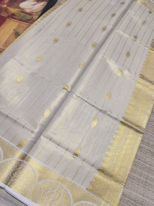 Premium tissue saree with all-over weave & grand pallu