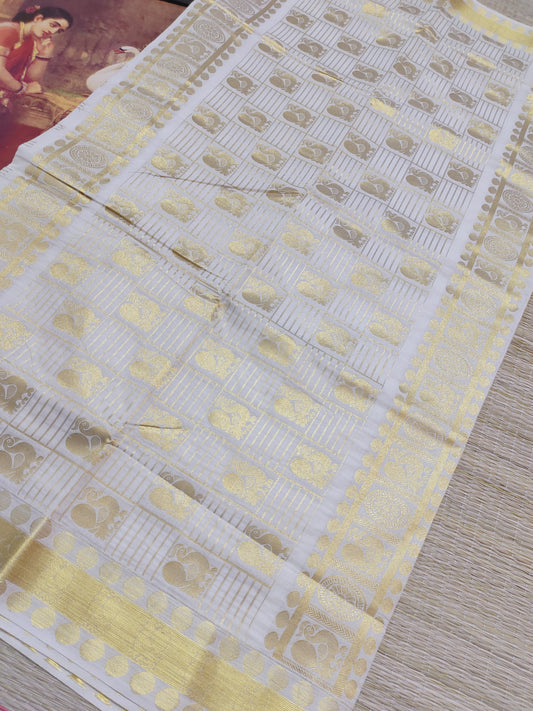 Kanjivaram Inspired Kasavu Cotton Saree With All-Over Checks And Motifs.