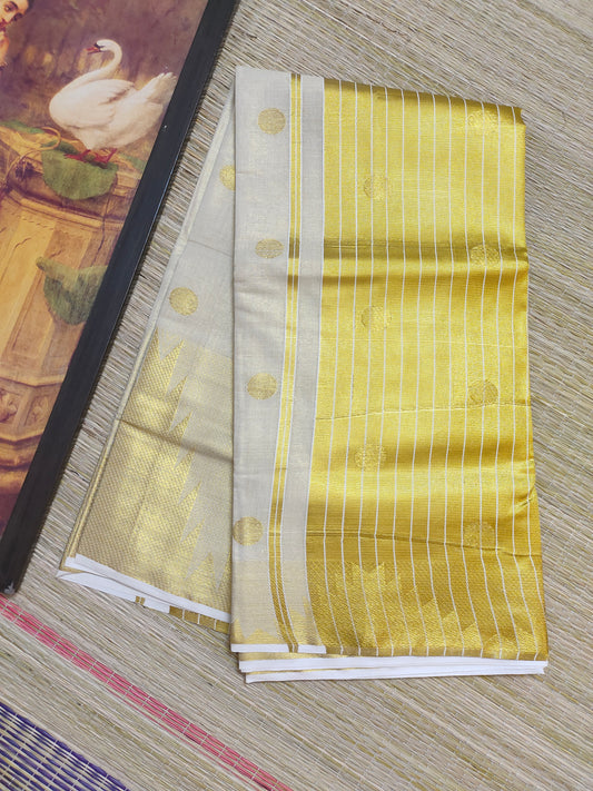Premium Tissue Saree With Temple Border And All-Over Polka Dots.