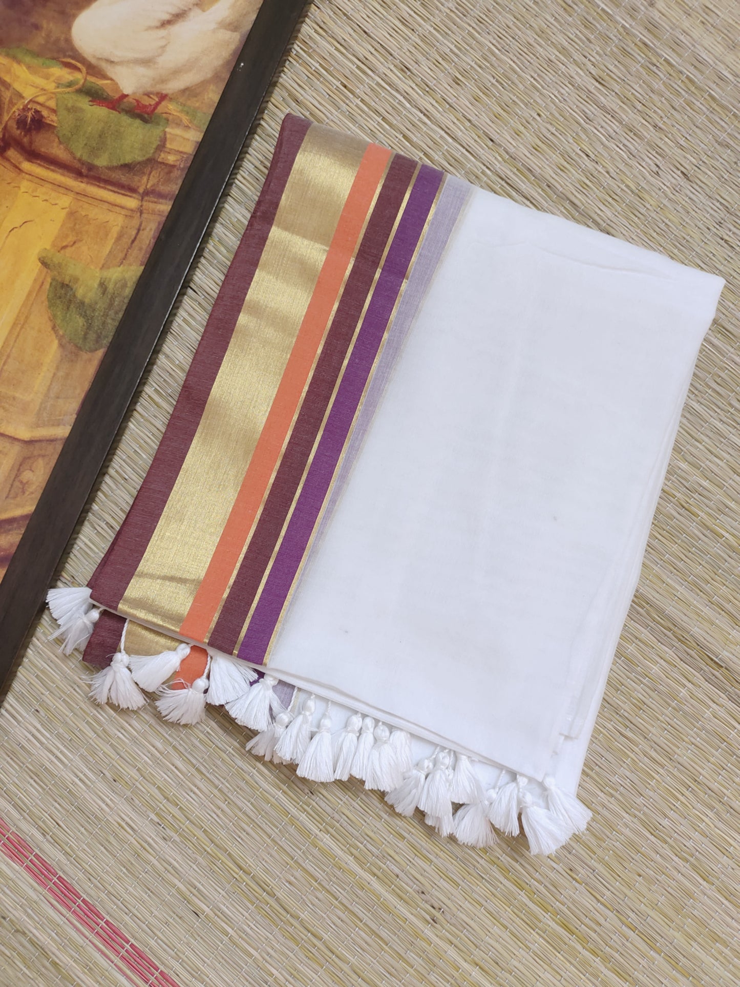 Premium Mul Cotton Saree With Zari Border And Tassels.