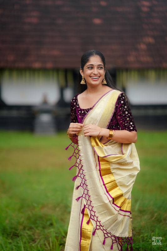 Half Plain Half Lines Tissue Set Mundu With Tassels And Velvet Sequence Blouse.