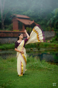 Half Plain Half Lines Tissue Set Mundu With Tassels And Velvet Sequence Blouse.