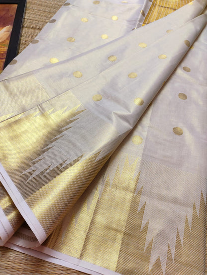 Premium Tissue Saree With Temple Border And All-Over Polka Dots.