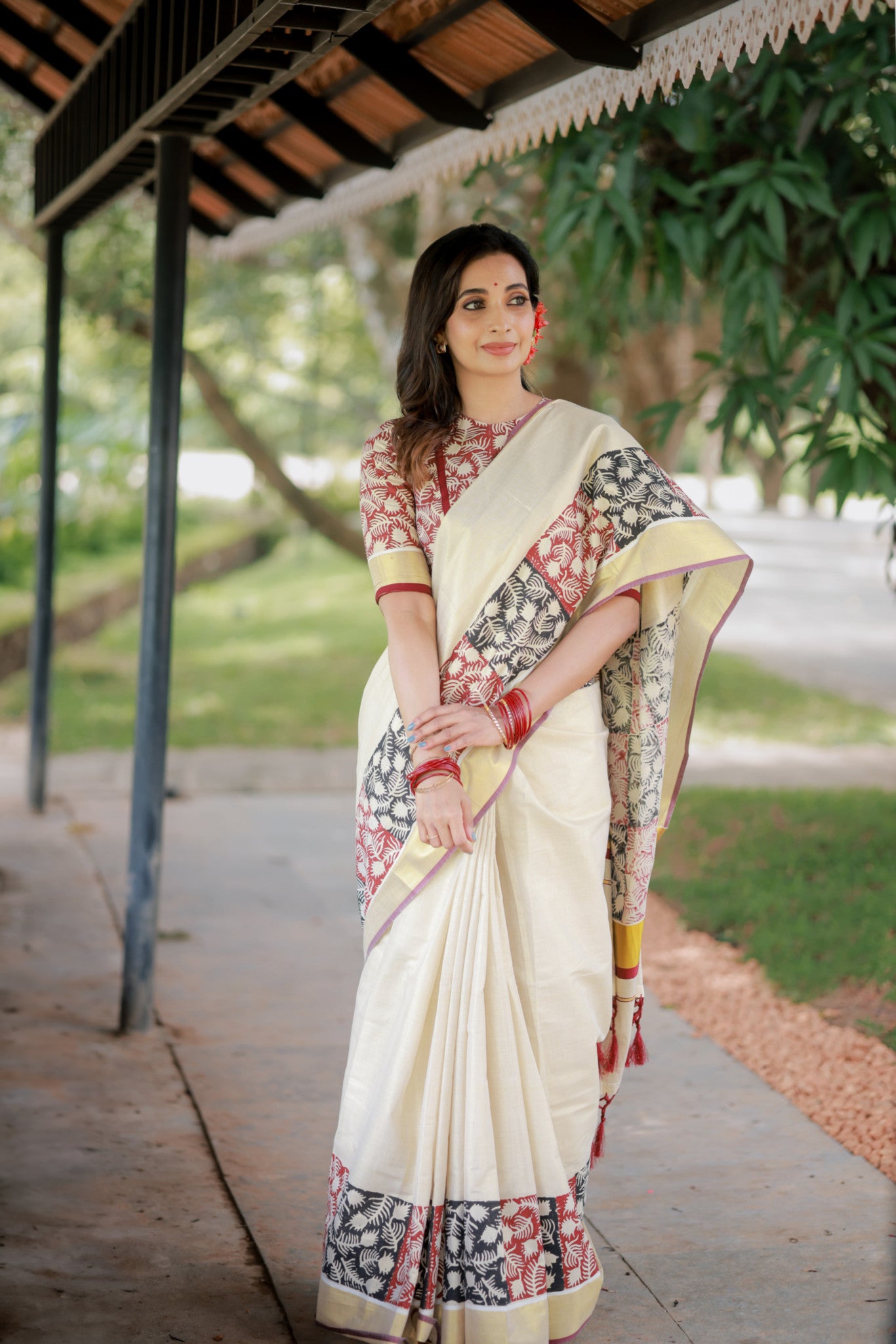 Premium gold tissue saree with maroon borders, hand block prints, and a fully printed blouse