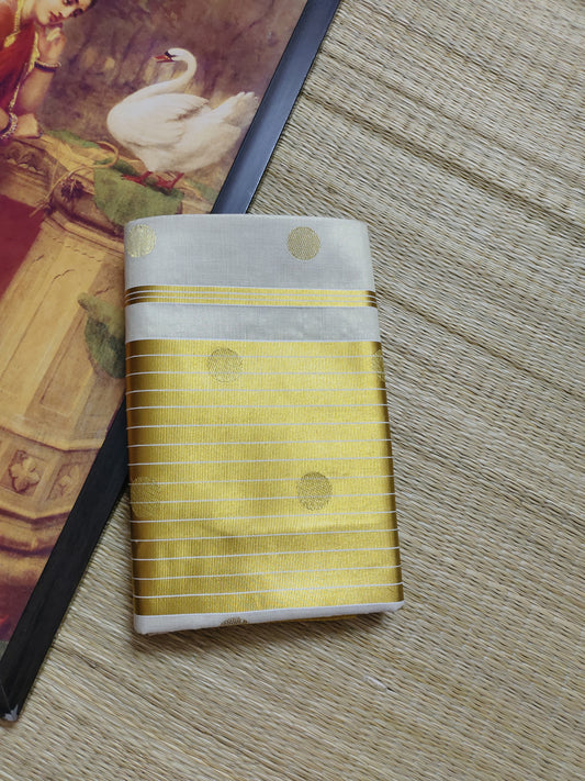 Premium Tissue Saree With Temple Border And All-Over Polka Dots.
