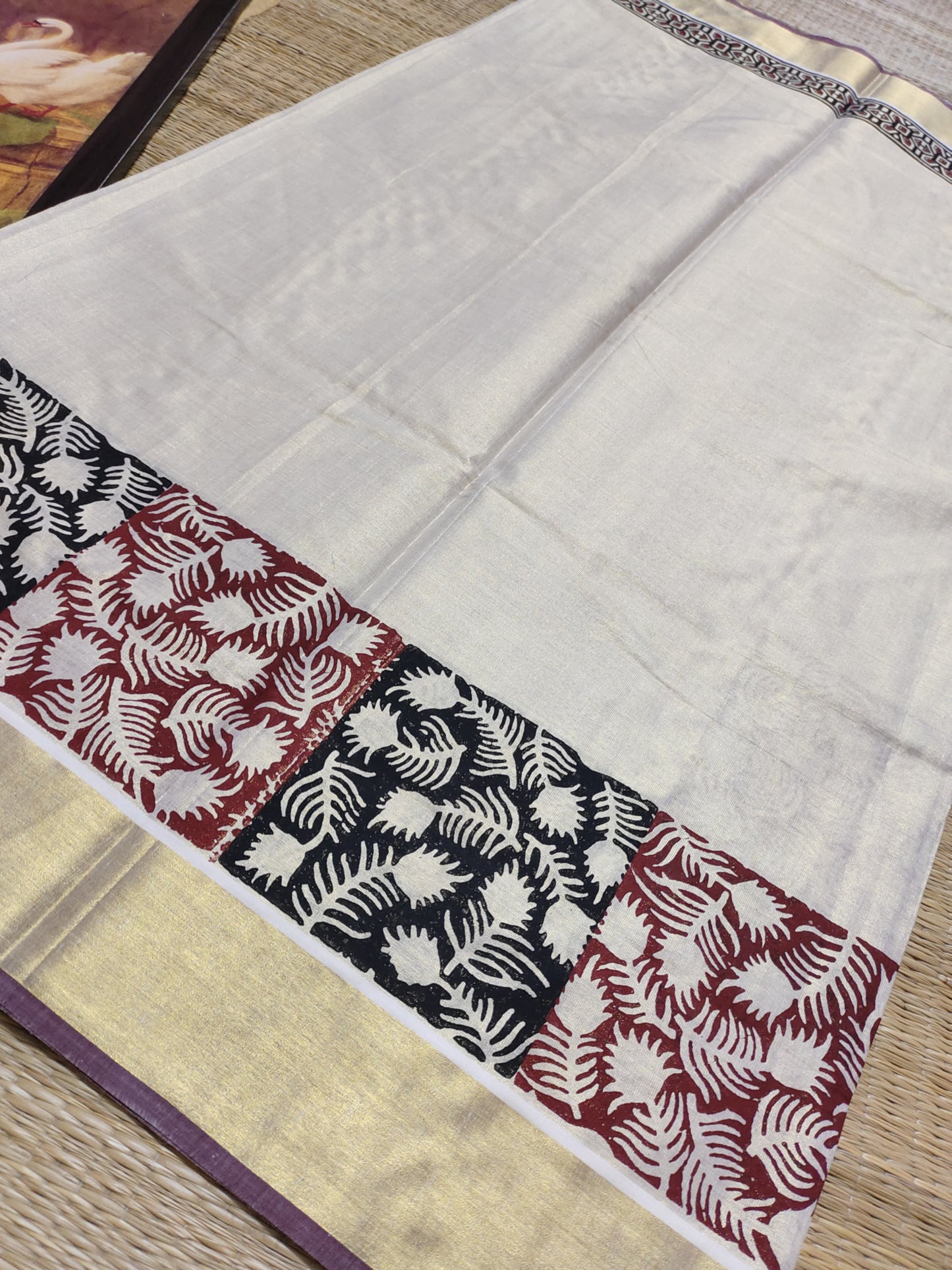 Premium gold tissue saree with maroon borders, hand block prints, and a fully printed blouse
