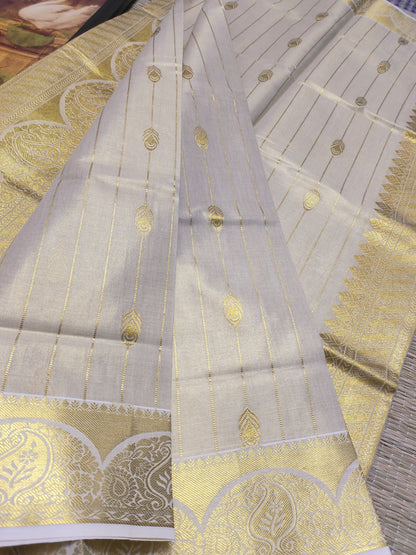 Premium tissue saree with all-over weave & grand pallu