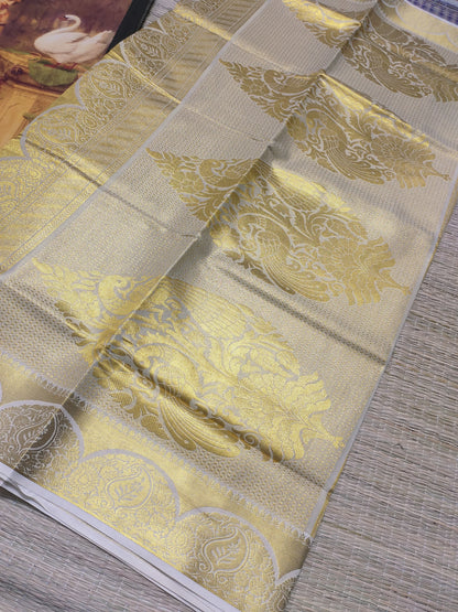 Premium tissue saree with all-over weave & grand pallu