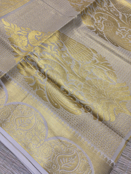 Premium tissue saree with all-over weave & grand pallu
