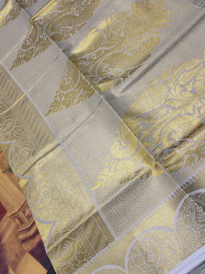 Premium tissue saree with all-over weave & grand pallu