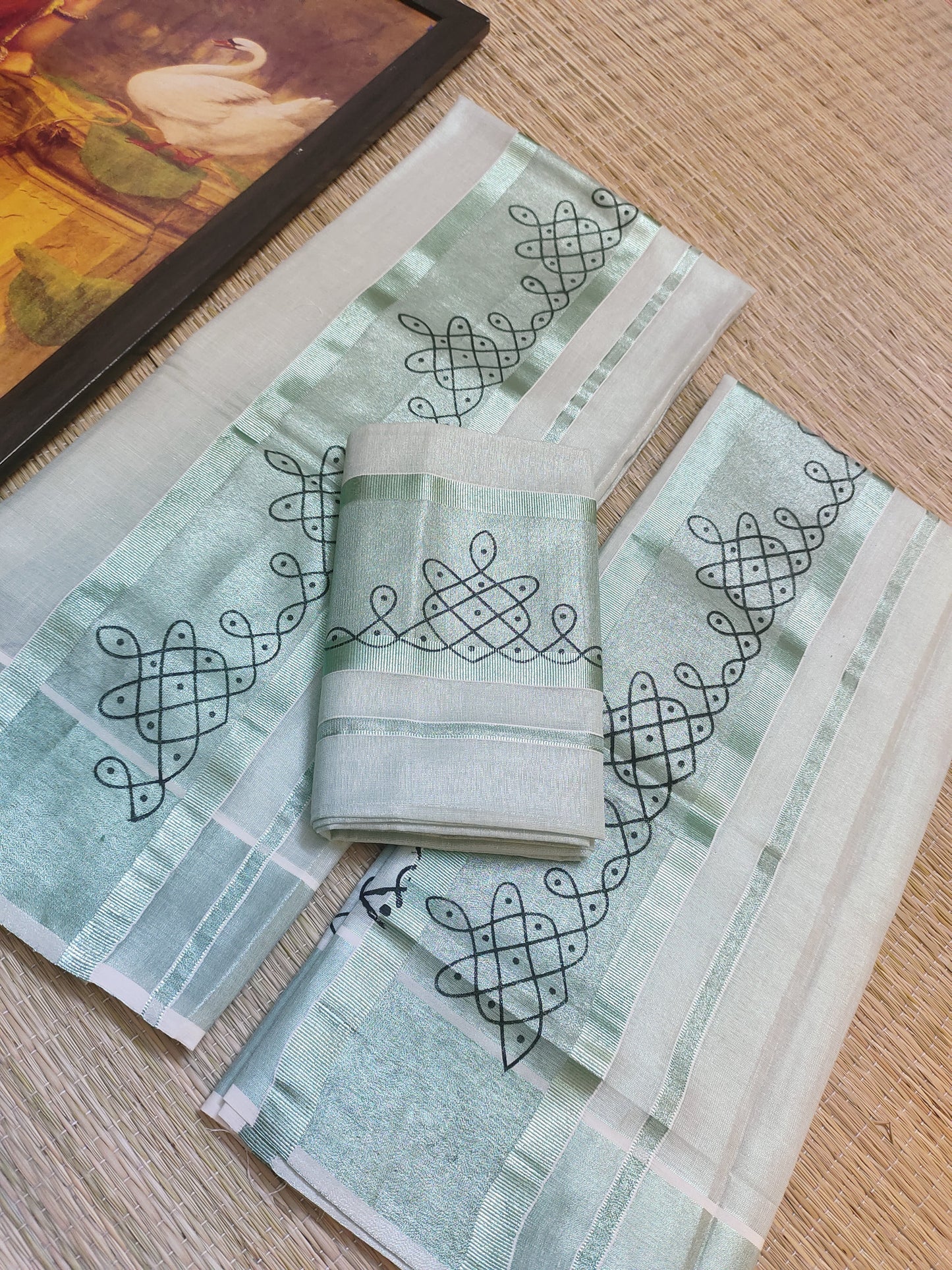 Green tissue Kerala Set Mundu with Kolam prints and matching printed blouse (2.80m).