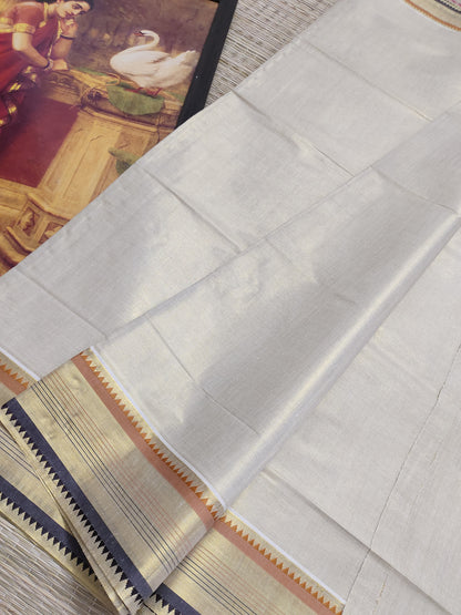 Tissue saree featuring an orange and purple kasavu