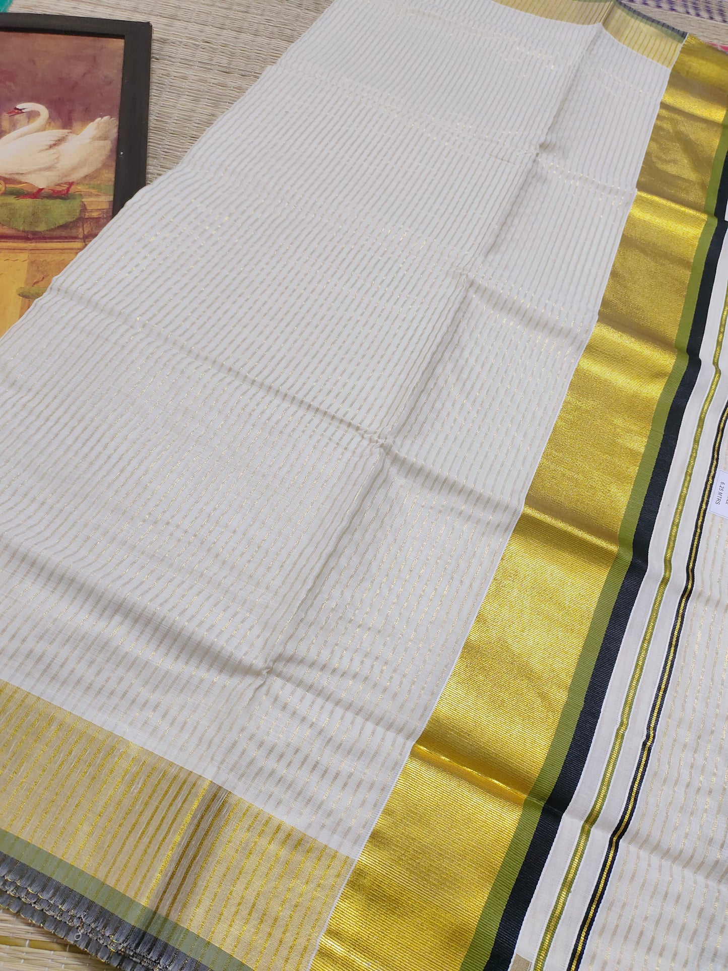 Pure cotton Kerala saree featuring all-over stripes