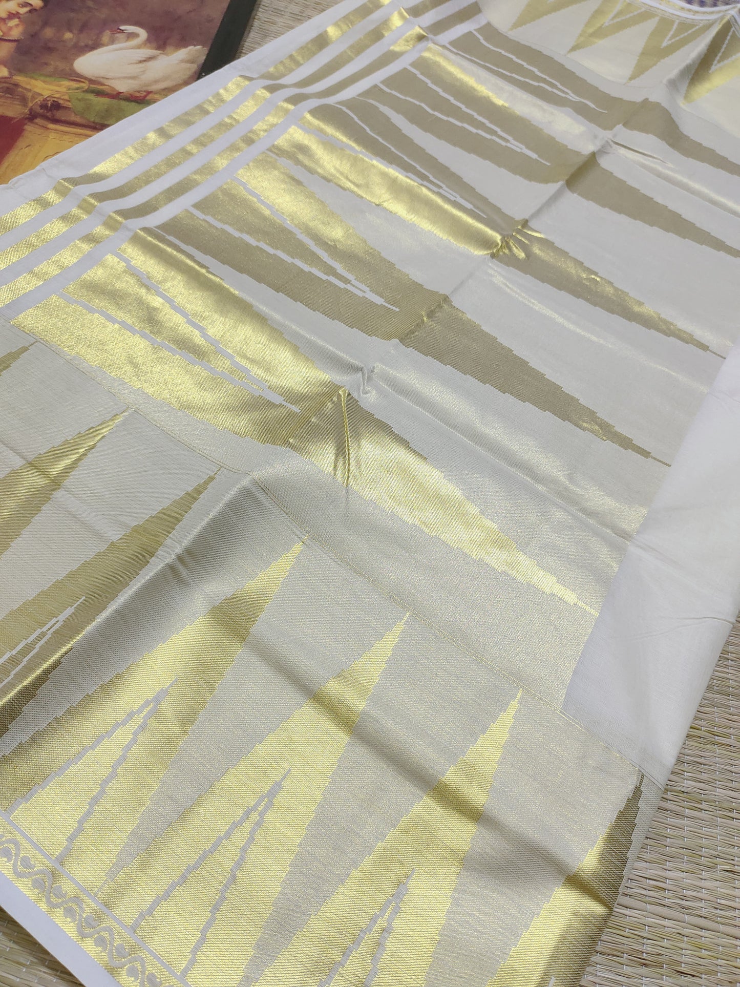 Premium cotton saree with temple borders and a rich pallu