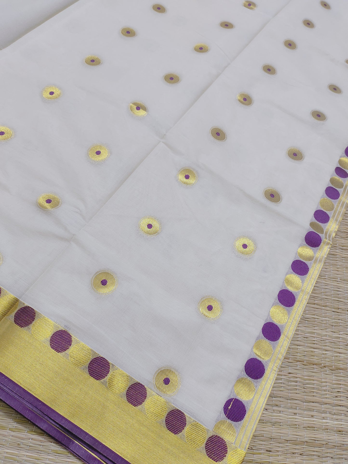 Premium Cotton Saree With All-Over Polka Weave And Woven Pallu.