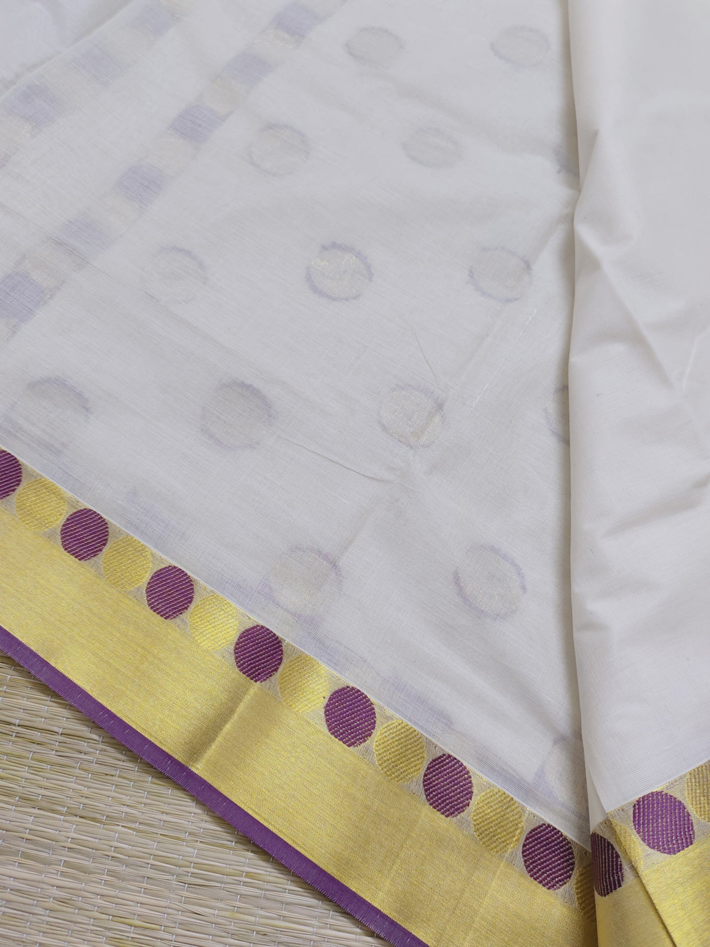 Premium Cotton Saree With All-Over Polka Weave And Woven Pallu.