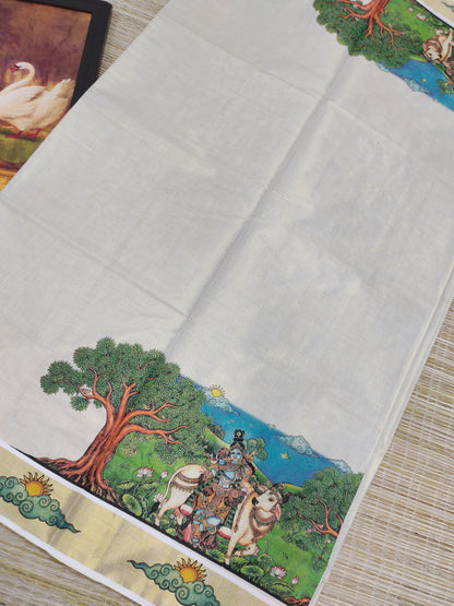 Golden tissue saree with mural prints and a plain running blouse