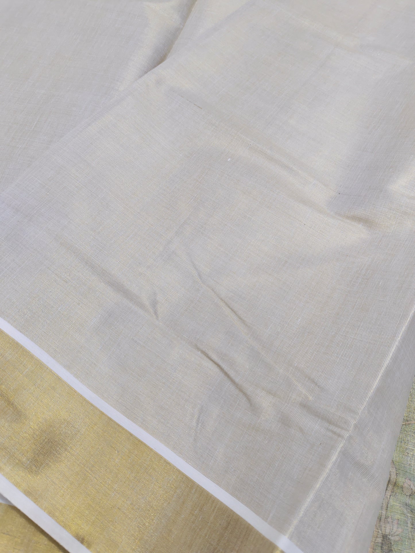 Golden tissue saree with mural prints and a plain running blouse