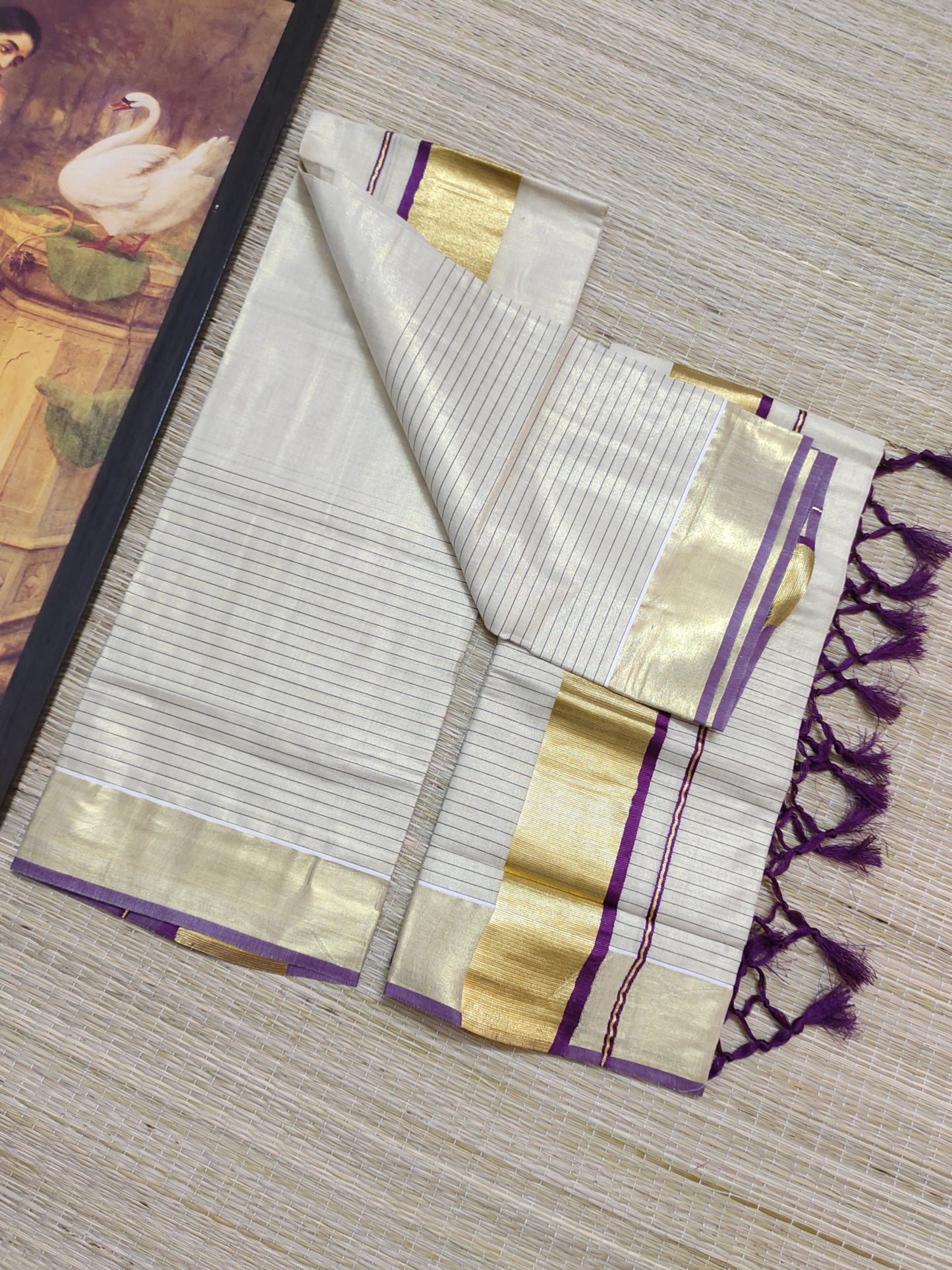 Half Plain Half Lines Tissue Set Mundu With Tassels And Velvet Sequence Blouse.