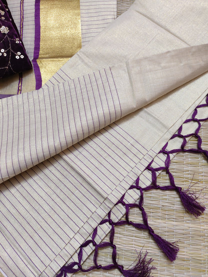 Half Plain Half Lines Tissue Set Mundu With Tassels And Velvet Sequence Blouse.