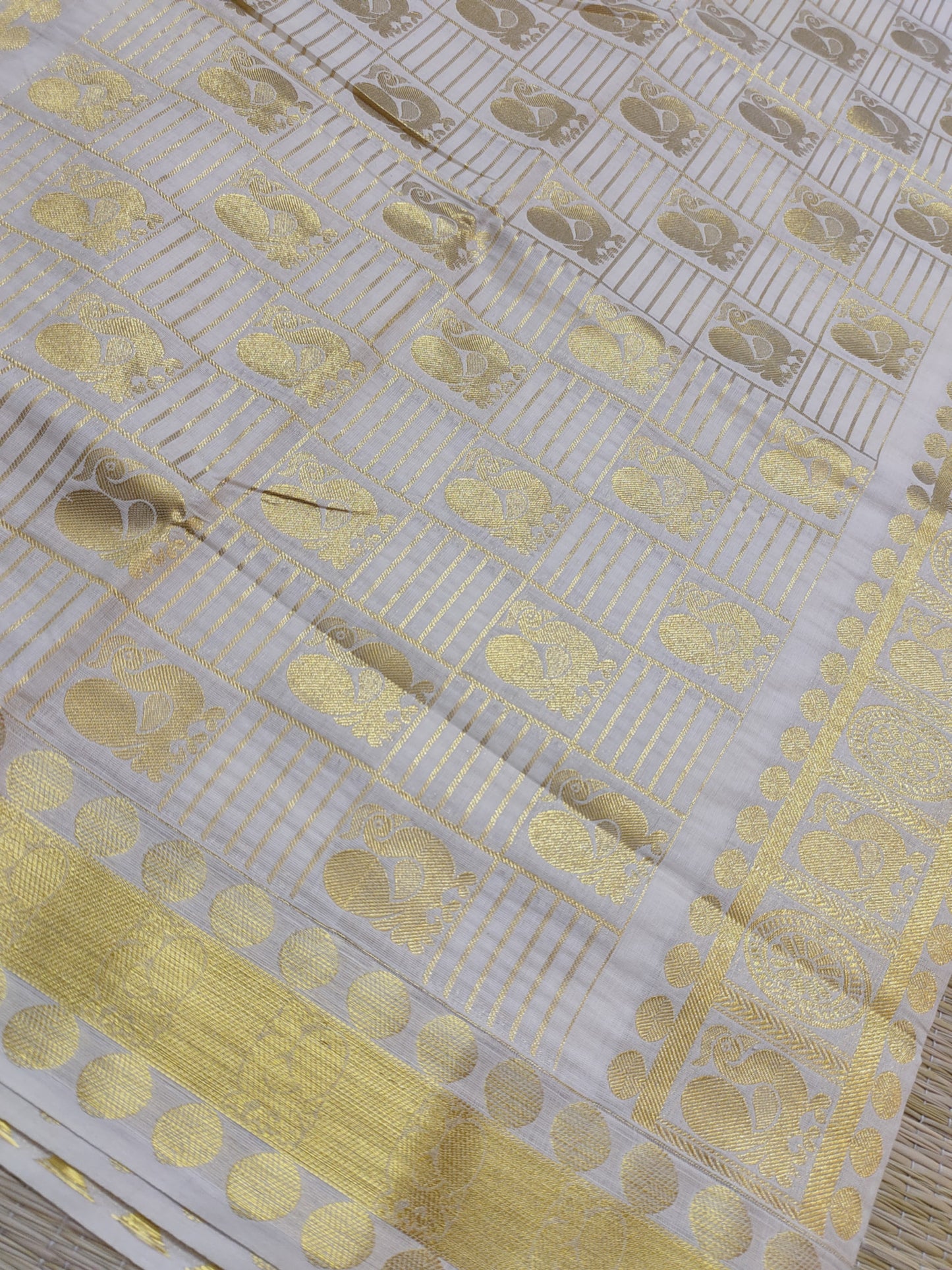 Kanjivaram Inspired Kasavu Cotton Saree With All-Over Checks And Motifs.