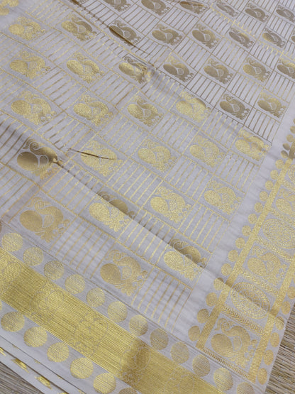 Kanjivaram Inspired Kasavu Cotton Saree With All-Over Checks And Motifs.