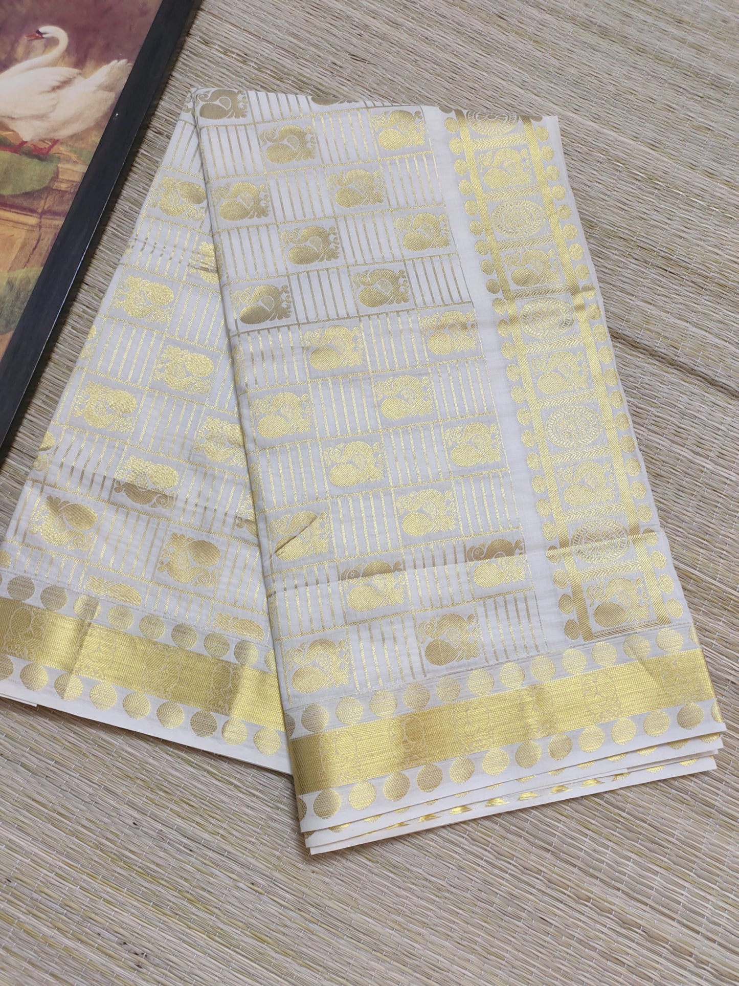 Kanjivaram Inspired Kasavu Cotton Saree With All-Over Checks And Motifs.