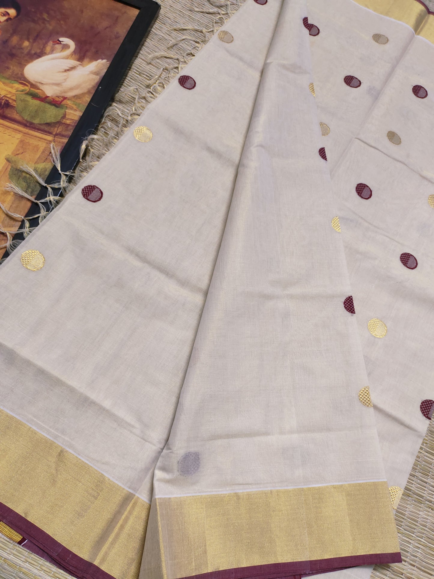 Premium Handloom Tissue Saree With All-Over Polka Weave.