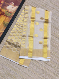 Kuthampully Handloom Tissue Saree With All-Over Polka Weave.