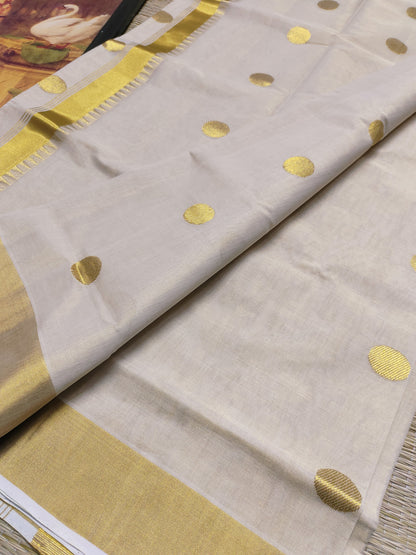 Kuthampully Handloom Tissue Saree With All-Over Polka Weave.