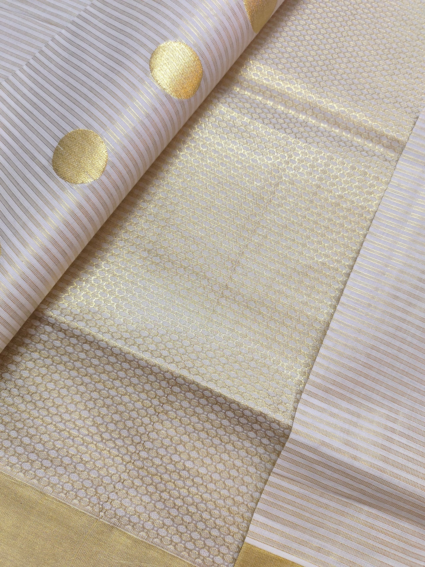 Premium Cotton Tissue Saree With All-Over Zari Lines, Polka Weave, And Brocade Blouse.