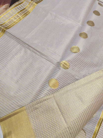 Premium Cotton Tissue Saree With All-Over Zari Lines, Polka Weave, And Brocade Blouse.