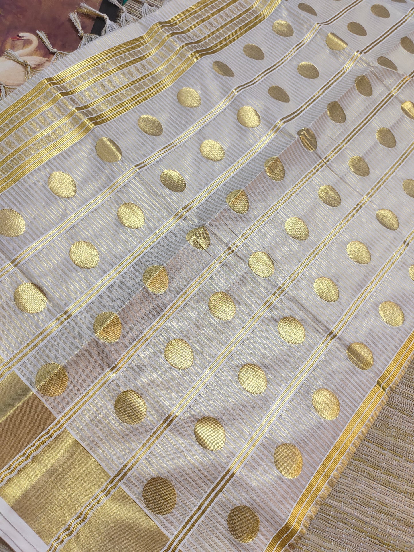 Premium Cotton Tissue Saree With All-Over Zari Lines, Polka Weave, And Brocade Blouse.