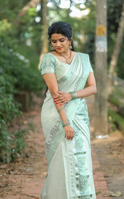 Green tissue Kerala Set Mundu with Kolam prints and matching printed blouse (2.80m).