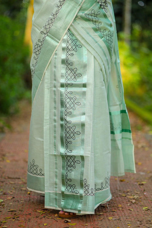 Green tissue Kerala Set Mundu with Kolam prints and matching printed blouse (2.80m).